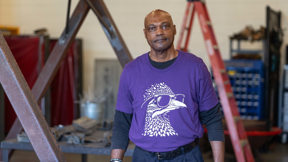 African American man wearing purple t-shirt