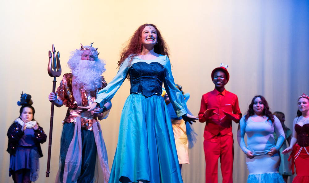 teens on stage performing "The Little Mermaid Jr."