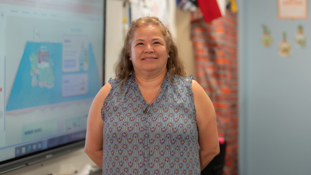 woman standing in her classroom