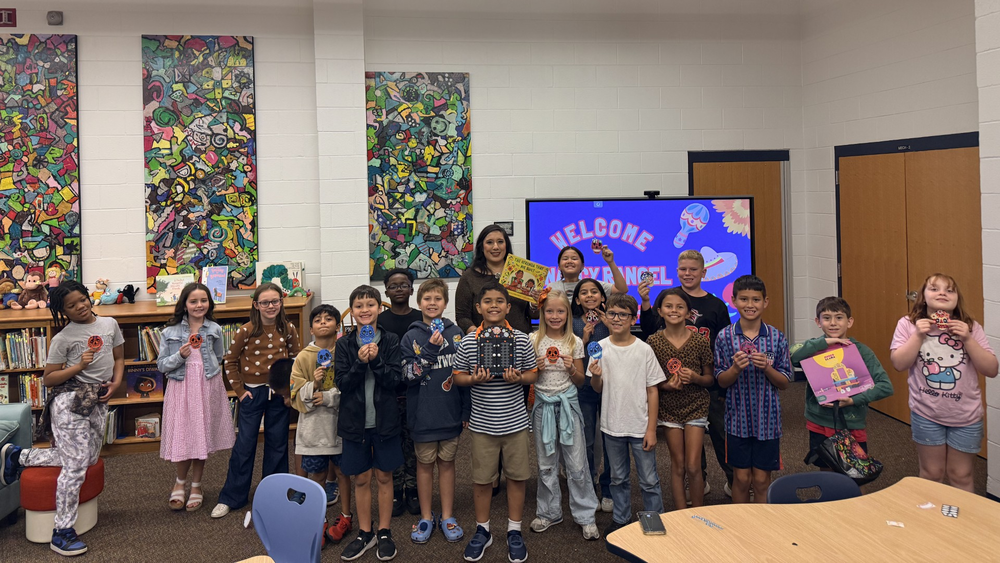 Nancy Rangel reading to 5th graders for Hispanic Heritage Month Celebration at Owens Elementary