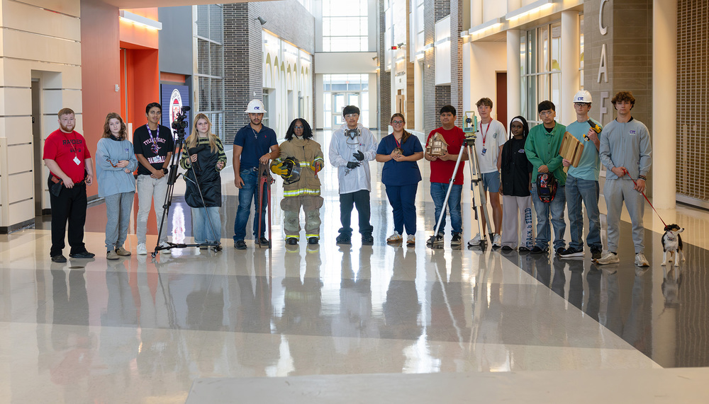 teen boys and girls dressed for a career - firefighter, chef, construction worker, AV technician, doctor