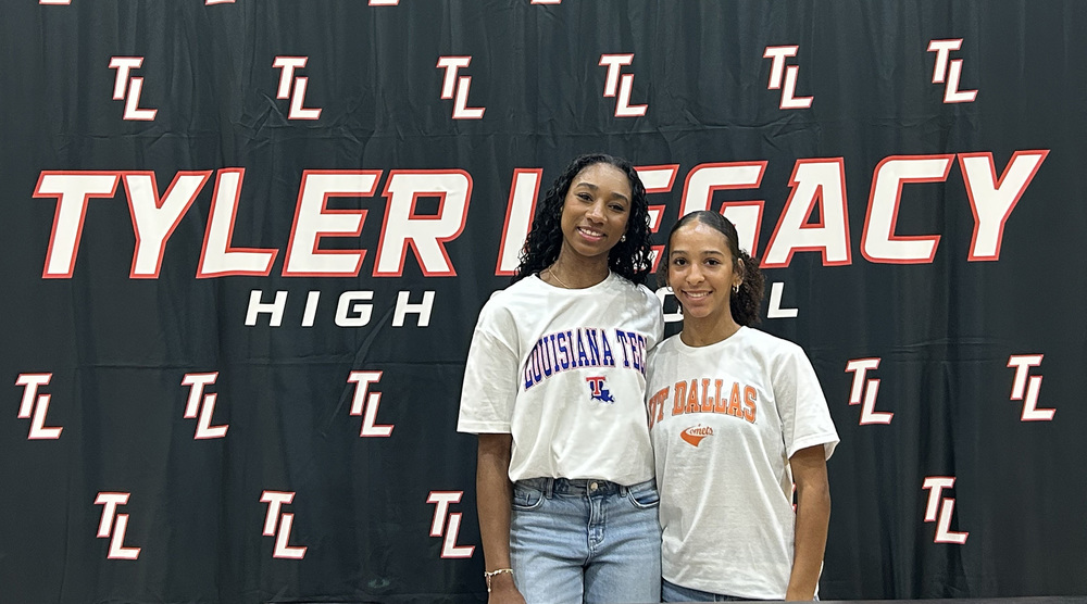 two teen girls standing in front of Tyler Legacy sign