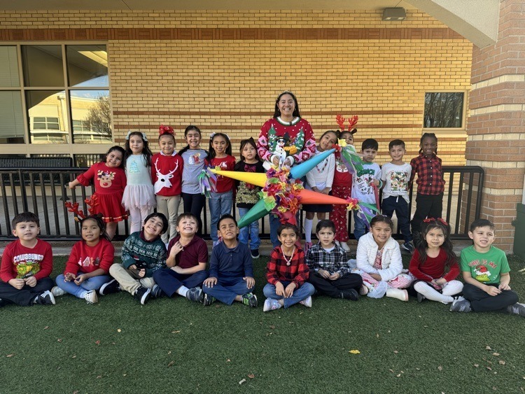 group phot of Ms. Vergara's class with a pinata