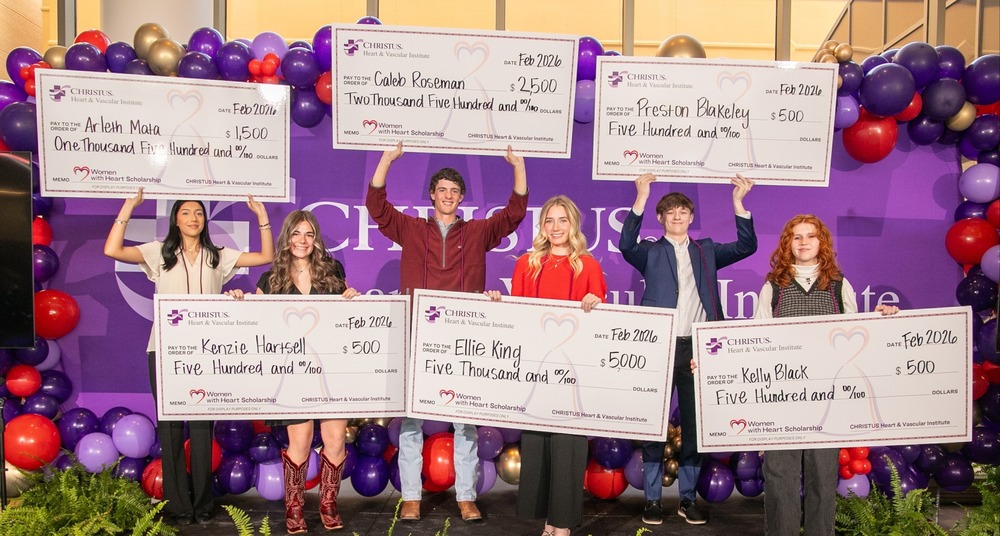 six teens holding giant checks with scholarship amounts