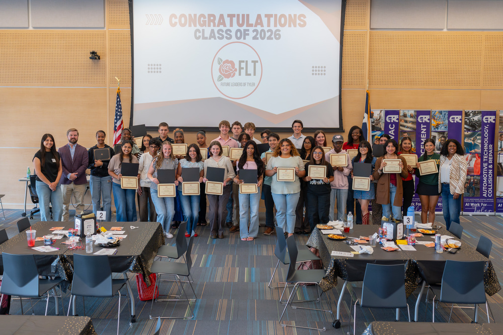 group of teens holding certificates 