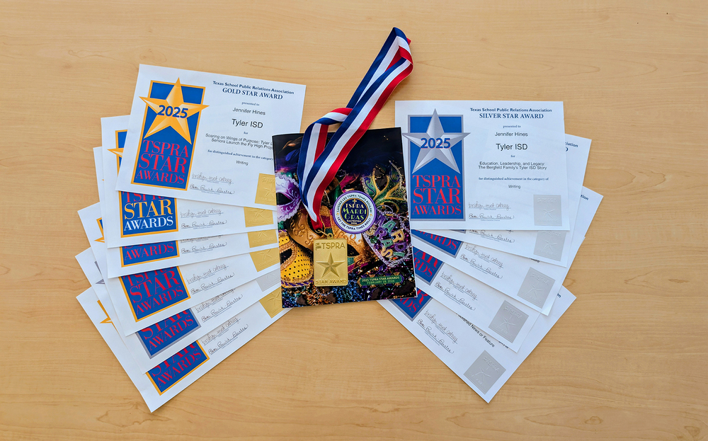 certificates and medals on a table