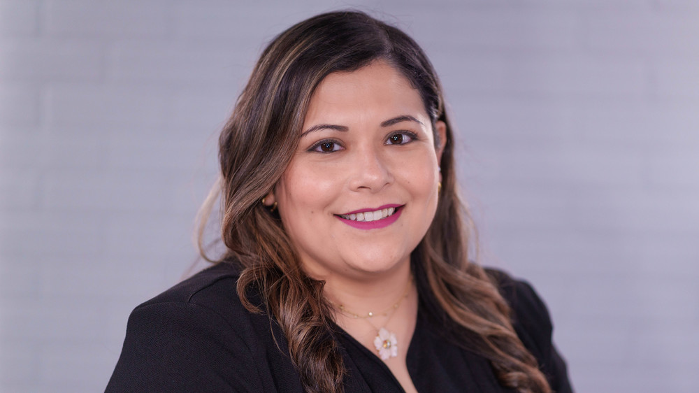 woman with long dark hair wearing black jacket