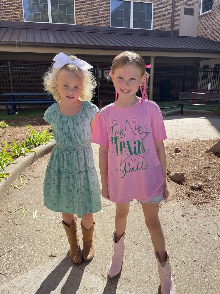 Girls dressed up in western wear for Round up day.