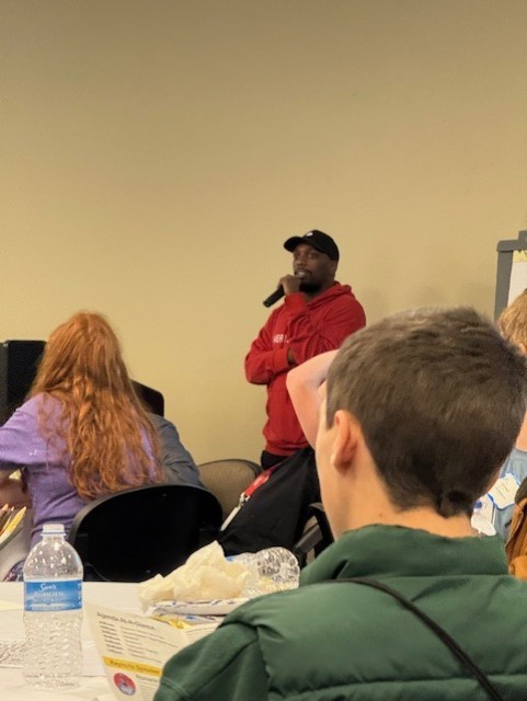 man speaking to group