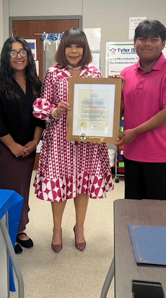 3 people holding a proclamation