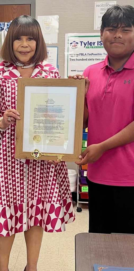 boy and lady holding a proclamation