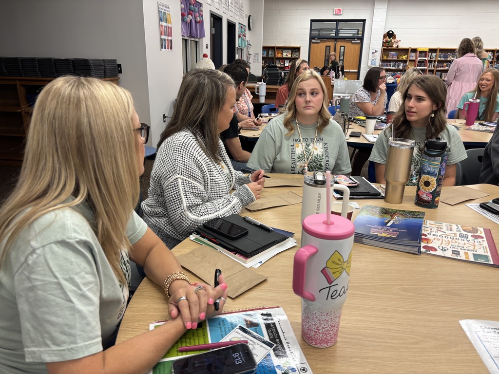 Teachers discussing at a meeting