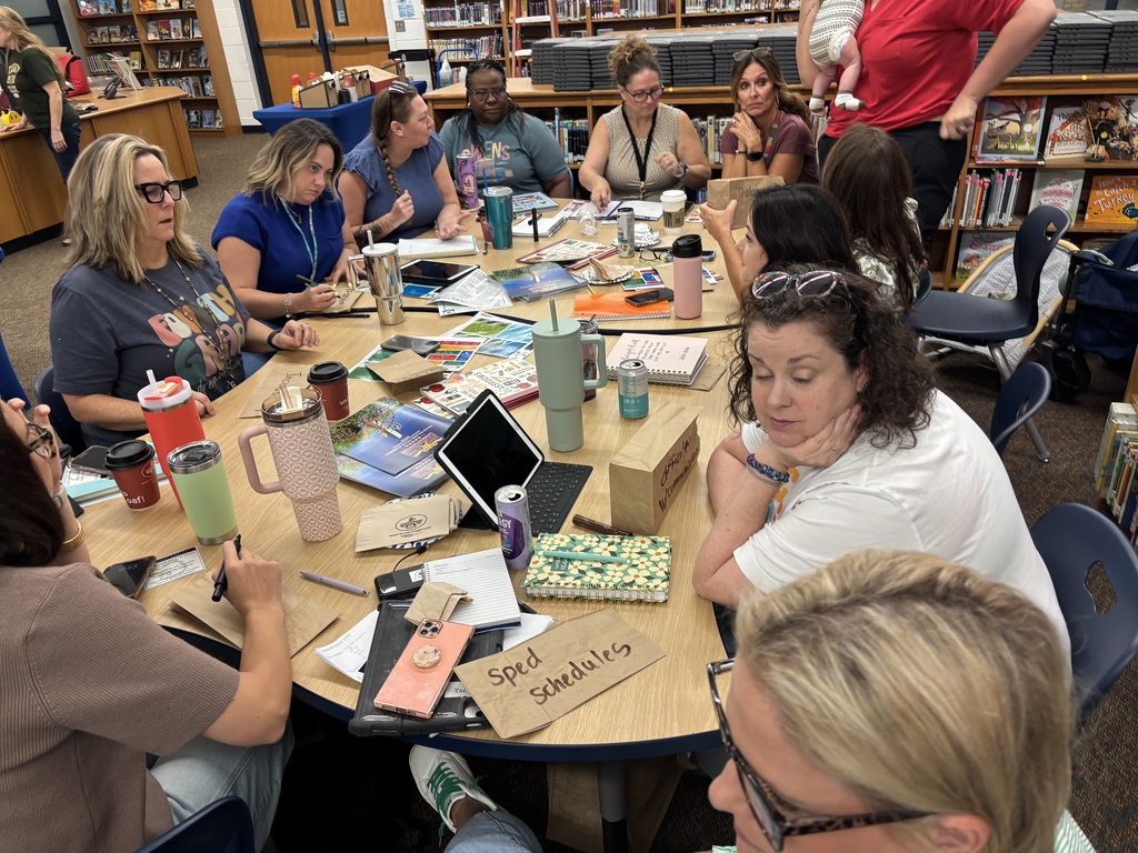 Teachers discussing during a training