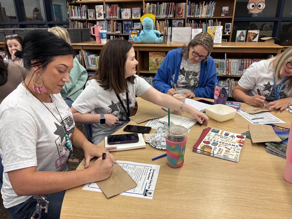 Teachers discussing at a meeting