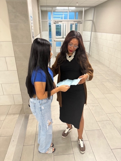 teacher and student in hallway