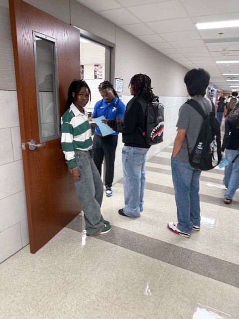 students at door of classroom with the teacher