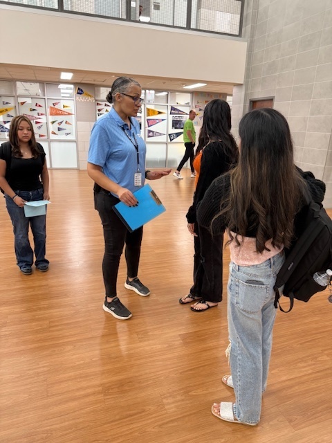 principal and students in the hallway
