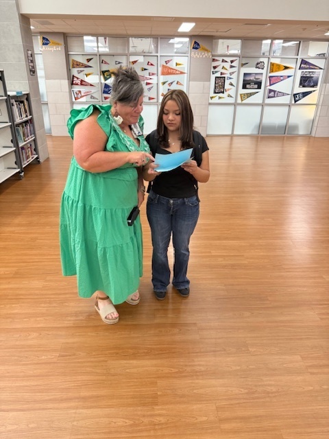 teacher and student in hallway