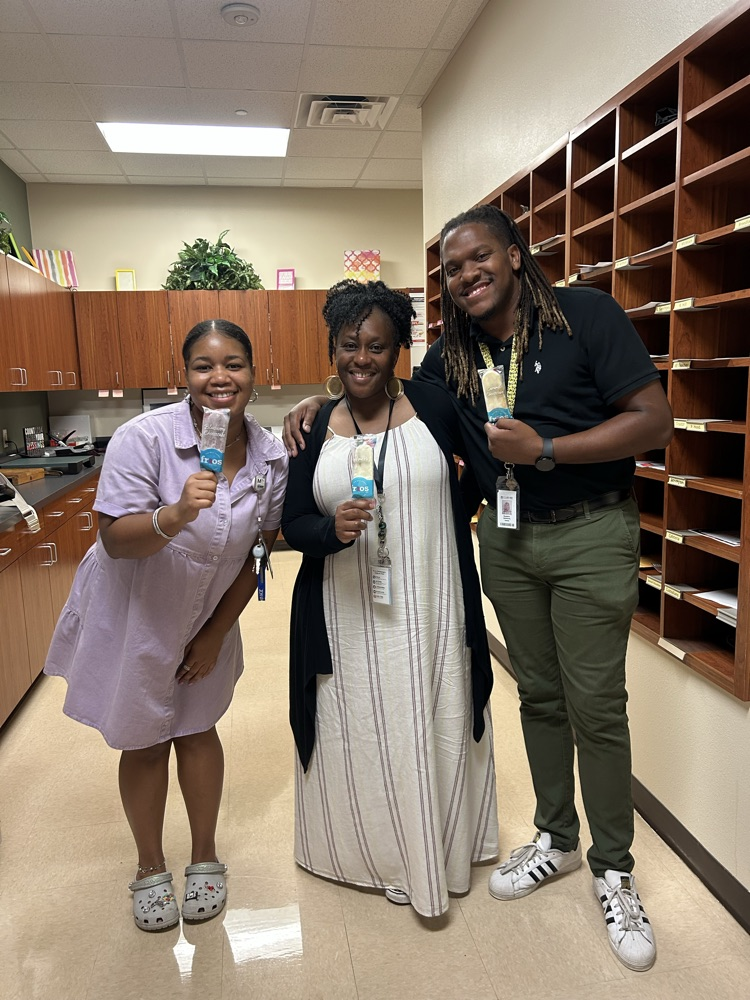 teachers smiling holding popsicles