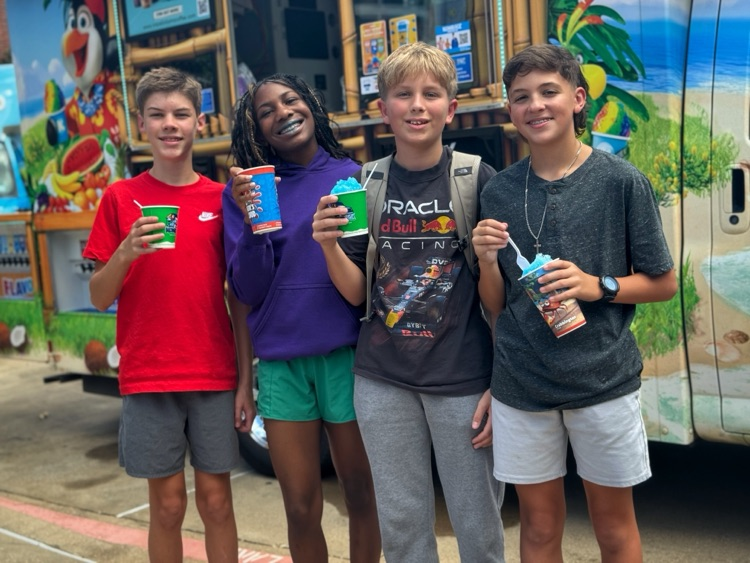 Students standing with Kona Ice in their hands.