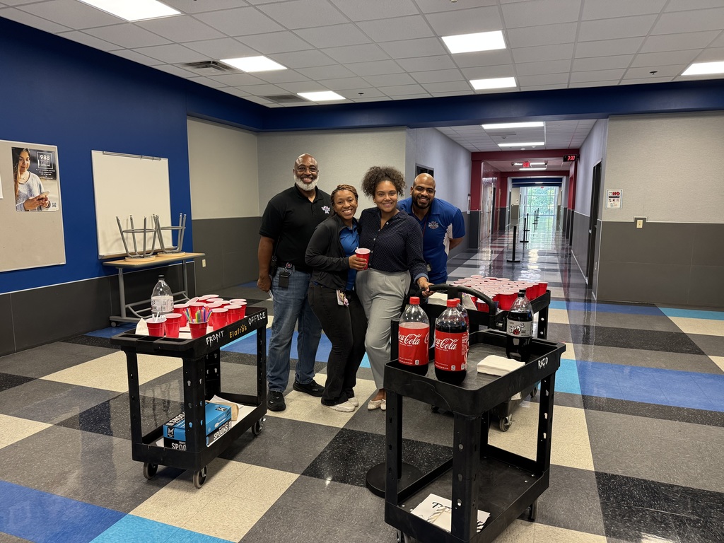 Boulter administrators bringing ice cream floats to teachers.