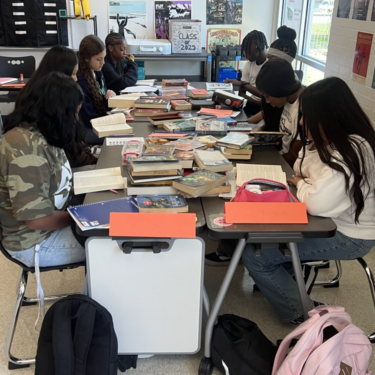 students reading a book