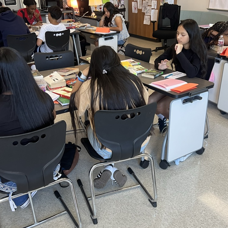 students reading a book