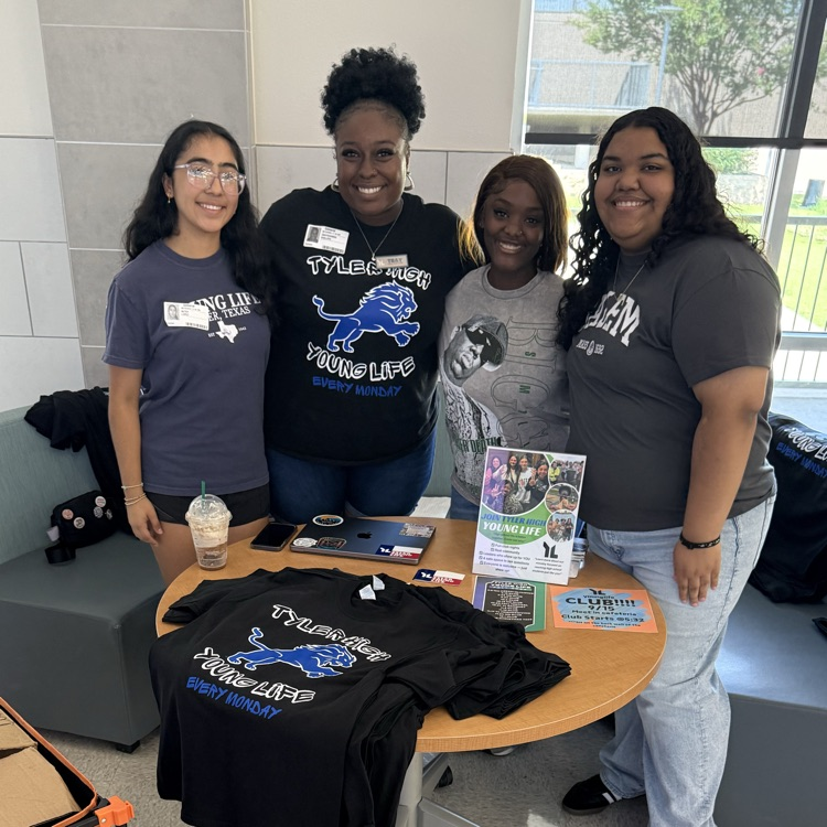 students at table getting free tshirt