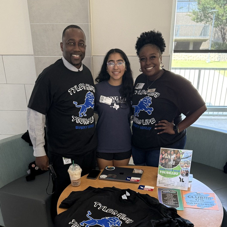 student and teacher with free tshirt on