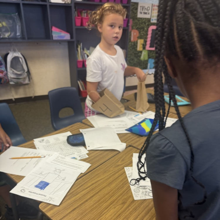 third grade students working together to analyze the different textures of objects