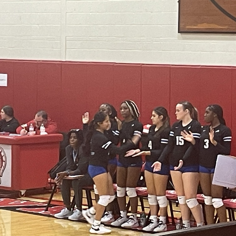 volleyball players on sideline