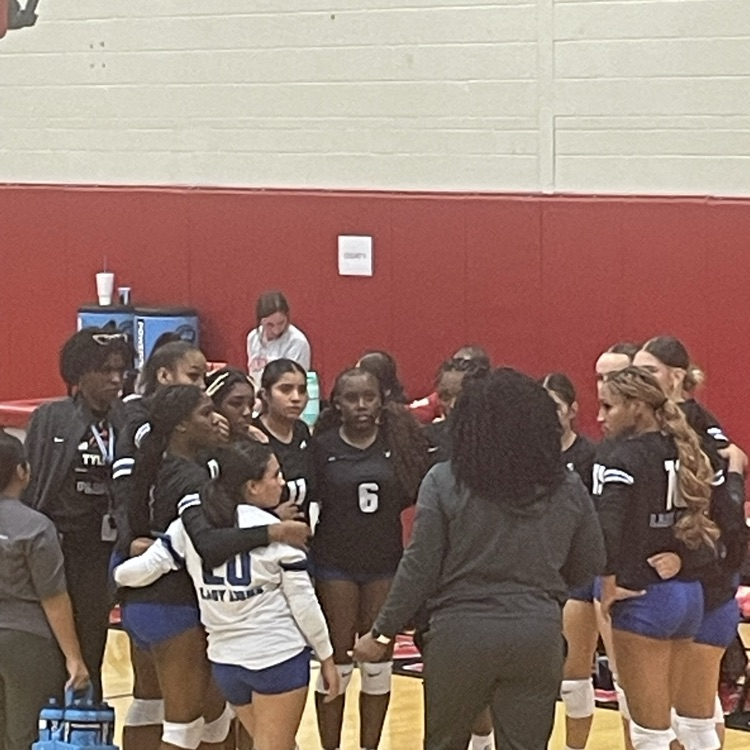 volleyball players in team huddle
