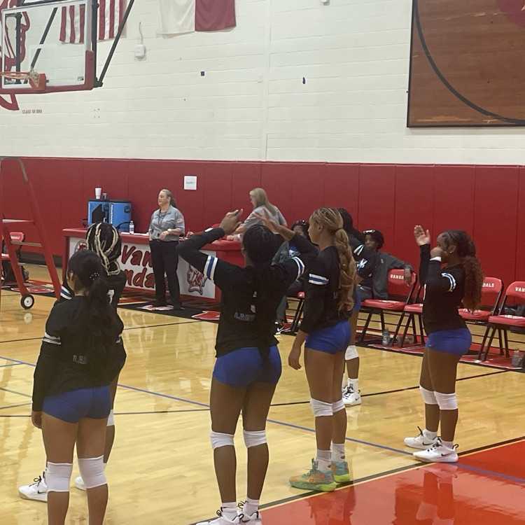 volleyball players on sideline