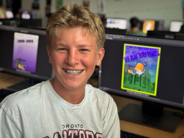 A student smiling in class.