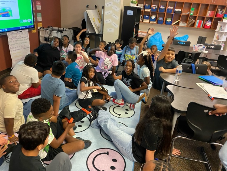 students smiling and working together