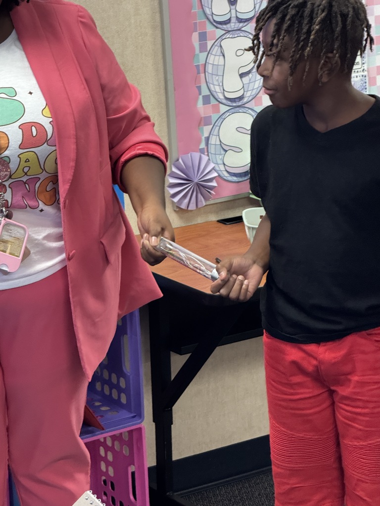 Students stood in a circle, holding hands to complete a circuit