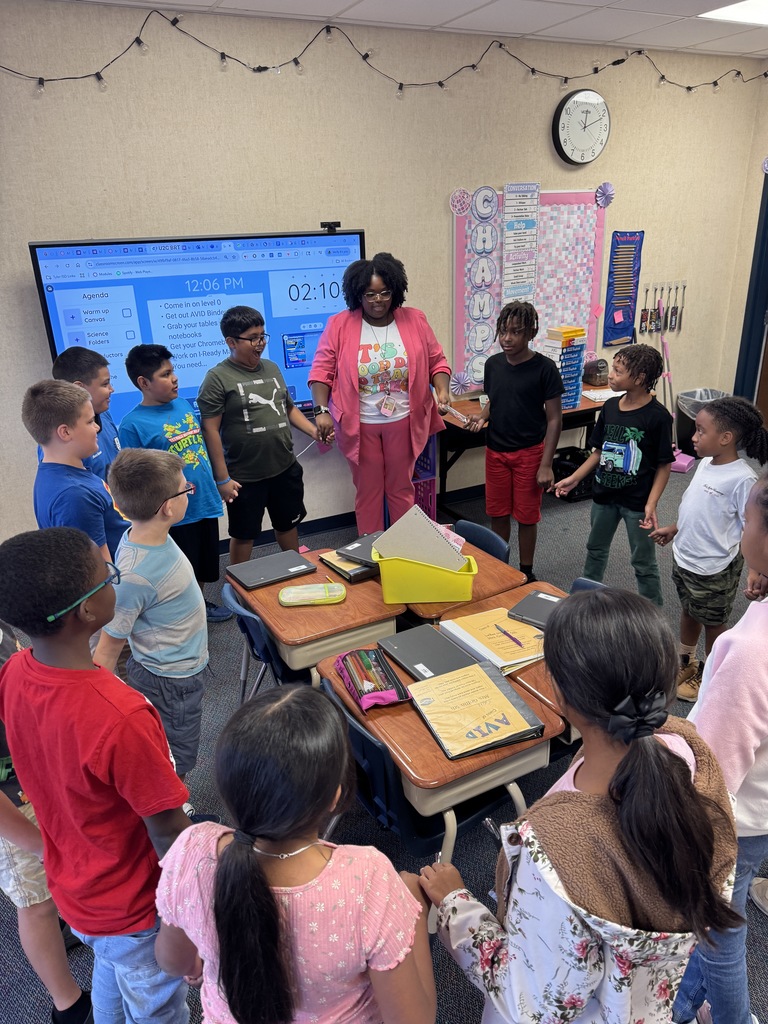 Students stood in a circle, holding hands to complete a circuit