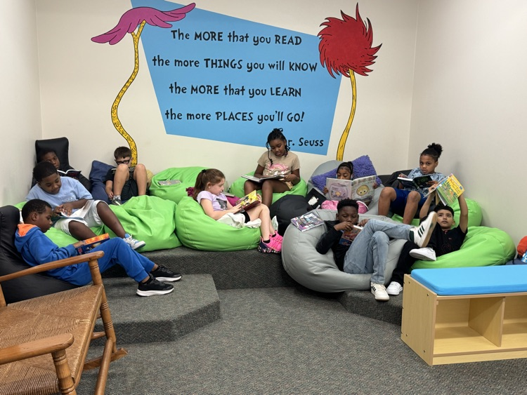 3rd graders reading in library