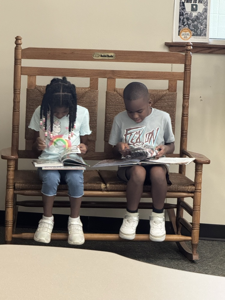 3rd graders reading in library