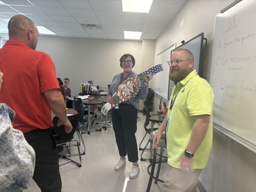Mrs. Alexander and her student with her walk through wednesday winners belt