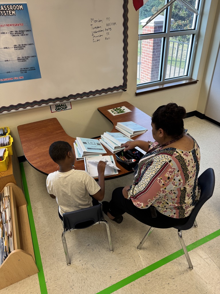 Student in a station with Ms Gomez