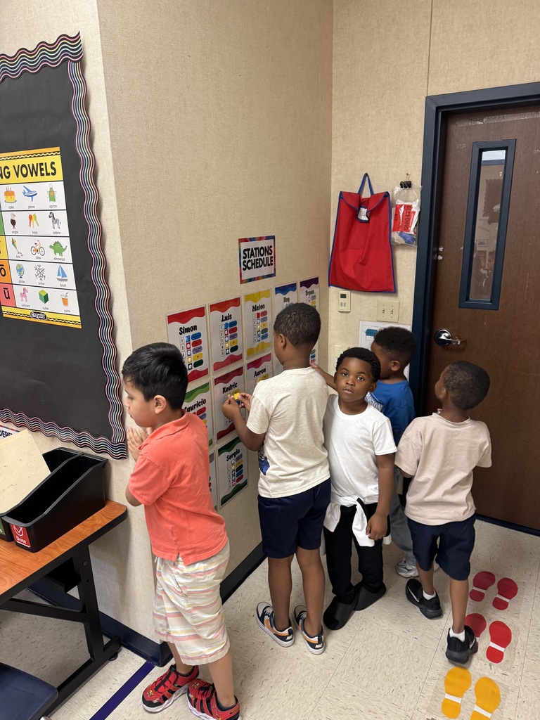 Students tracking thier station at the station board. 