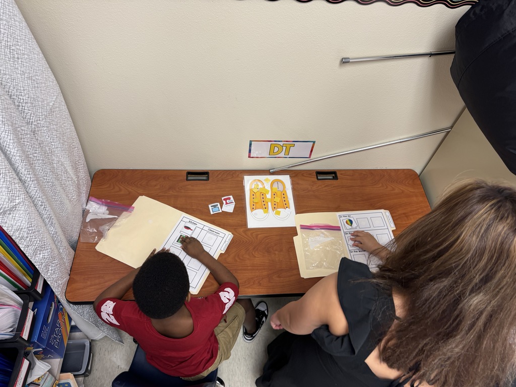 Students in stations with Ms. Tamano
