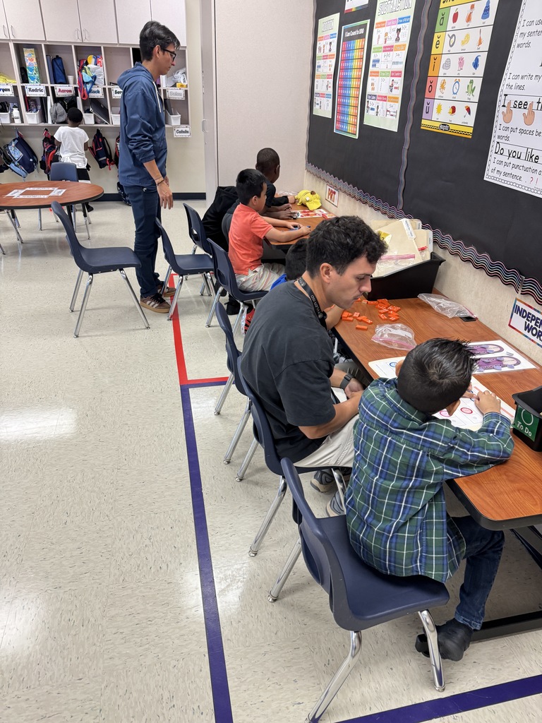 Students in stations with Mr Chavino and Mr Carmona