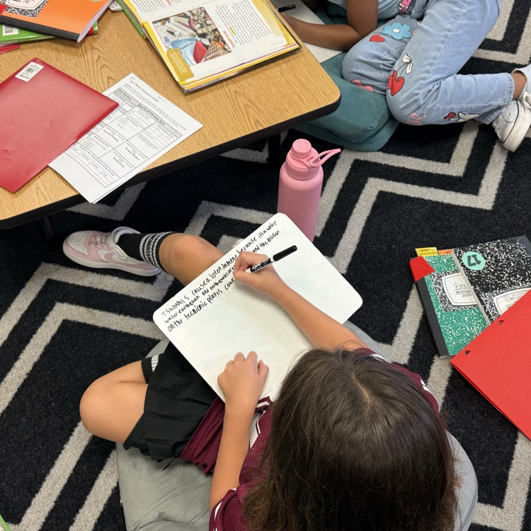 students writing about tsunami‘s and landslides on Whitehorse