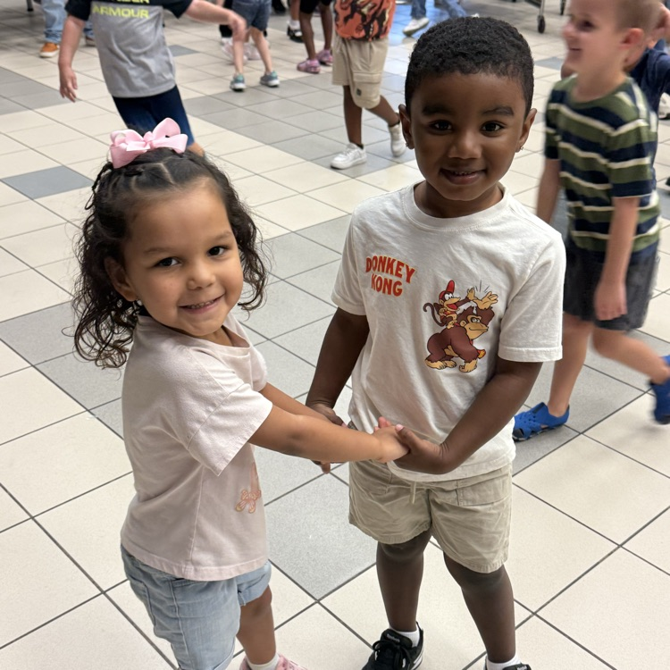 Two students dancing at behavior party