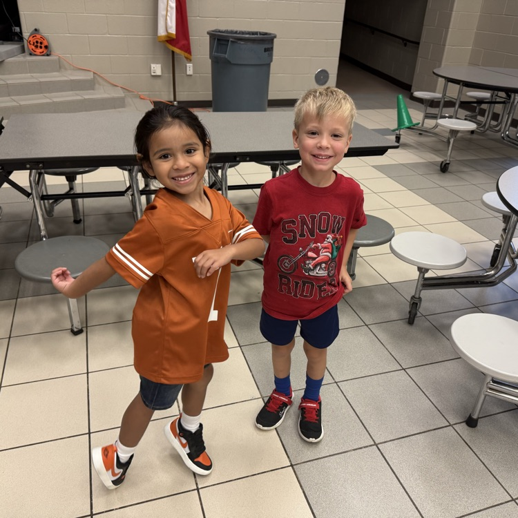 Two students dancing at behavior party