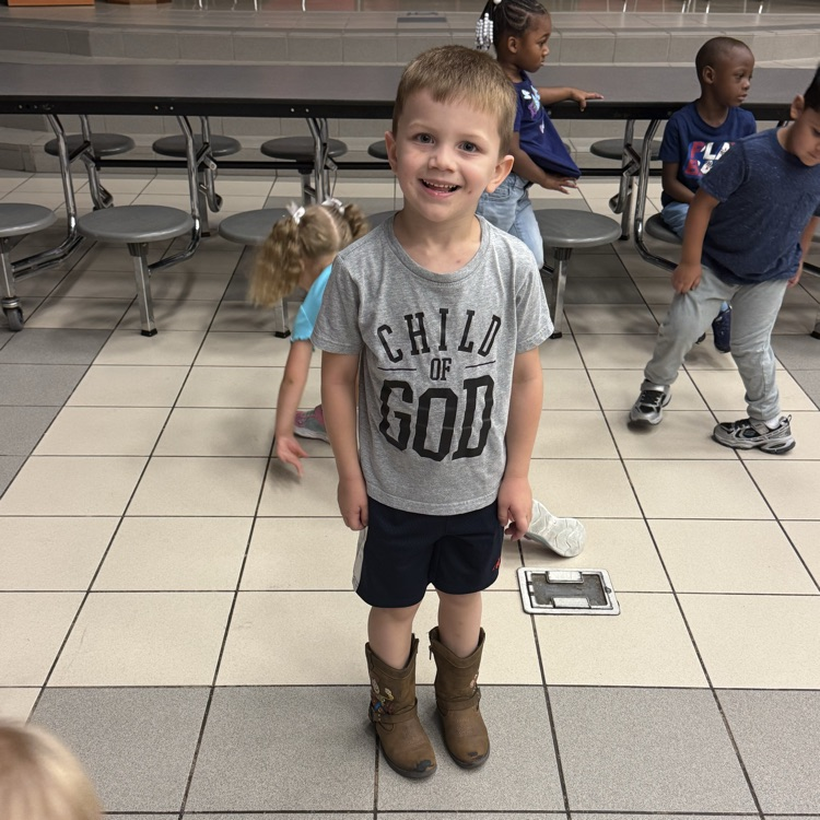 student smiling at behavior party