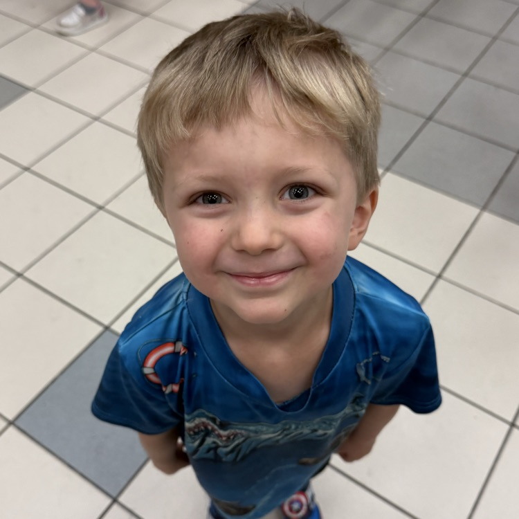Student smiling at behavior party