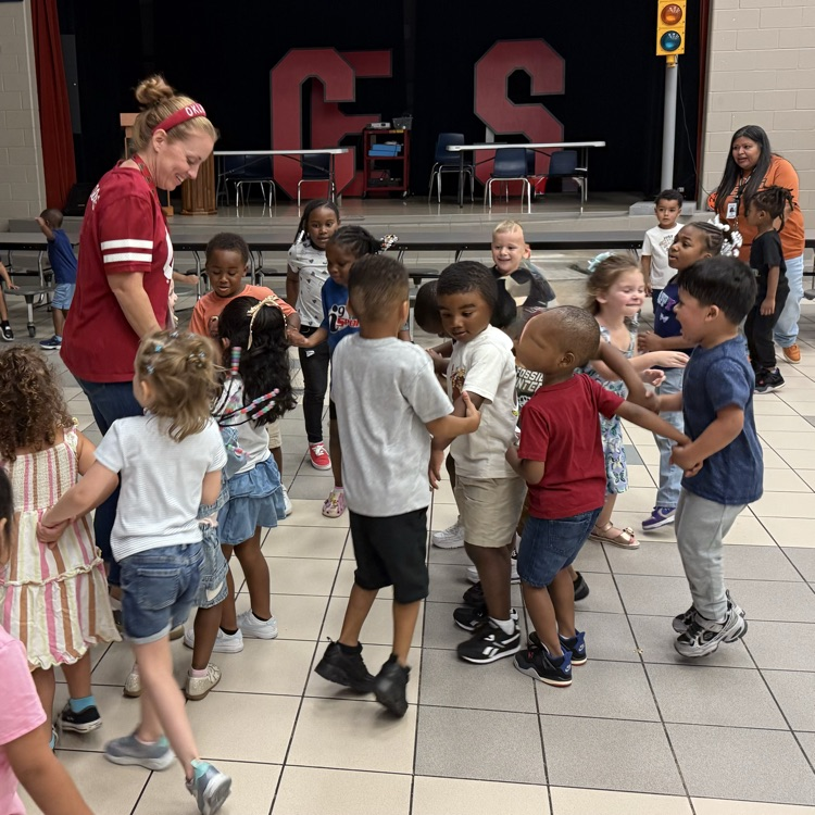 Students dancing with principal behavior party